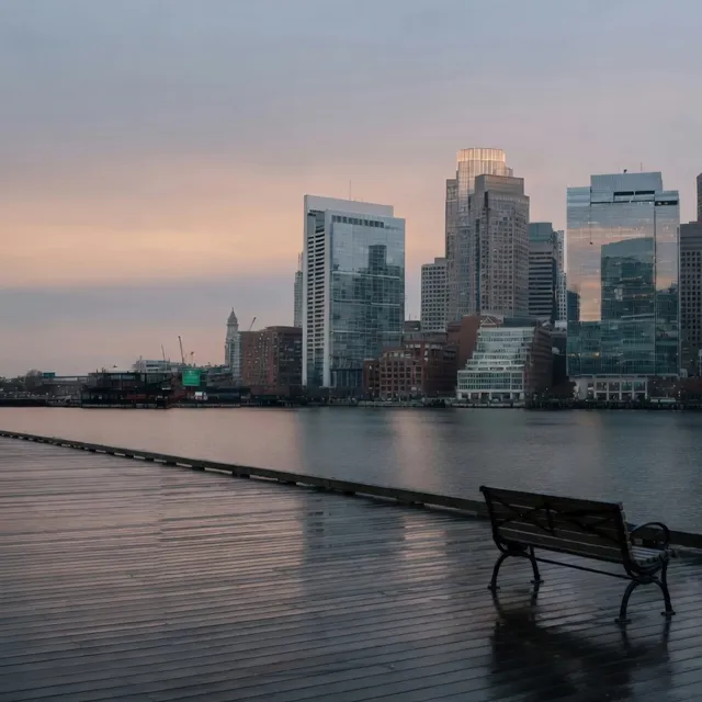 Empty Seaport Harborwalk at dawn facing the Boston skyline for business VoIP